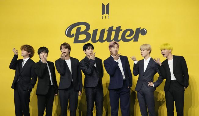 Members of South Korean K-pop band BTS, V, SUGA, JIN, Jung Kook, RM, Jimin, and j-hope from left to right, pose for photographers ahead of a press conference to introduce their new single &amp;quot;Butter&amp;quot; in Seoul, South Korea, Friday, May 21, 2021. South Korea may conduct a public survey to help determine whether to grant exemptions of the mandatory military service to members of the K-pop superstar boyband BTS, officials said Wednesday, Aug. 31, 2022. (AP Photo/Lee Jin-man, File)