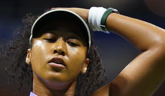 Naomi Osaka, of Japan, reacts after losing a point to Danielle Collins, of the United States, during the first round of the US Open tennis championships, Tuesday, Aug. 30, 2022, in New York. (AP Photo/Frank Franklin II)