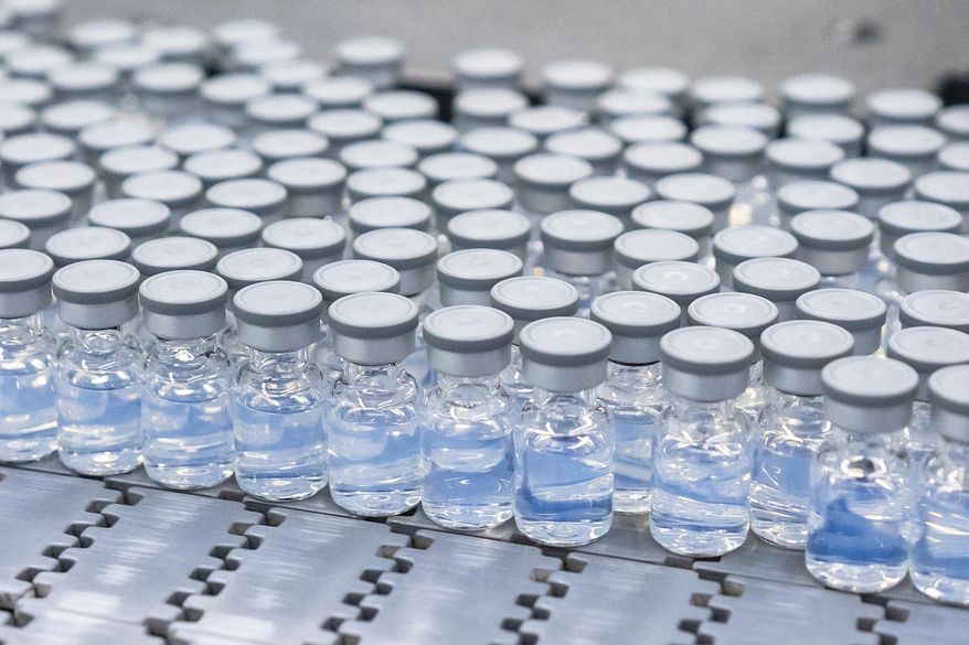 This August 2022 photo provided by Pfizer shows vials of the company&#39;s updated COVID-19 vaccine during production in Kalamazoo, Mich.   U.S. regulators have authorized updated COVID-19 boosters, the first to directly target today&#39;s most common omicron strain. The move on Wednesday, Aug. 13, 2022,  by the Food and Drug Administration tweaks the recipe of shots made by Pfizer and rival Moderna  that already have saved millions of lives.  (Pfizer via AP)