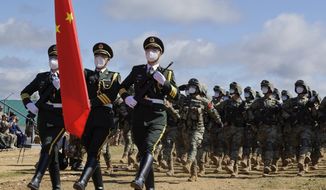In this handout photo released by Russian Defense Ministry Press Service, Chinese troops march during the Vostok 2022 military exercise at a firing range in Russia&#39;s Far East, Wednesday, Aug. 31, 2022. Russia on Thursday launched weeklong war games involving forces from China and other nations in a show of growing defense cooperation between Moscow and Beijing, as they both face tensions with the United States. (Vadim Savitsky/Russian Defense Ministry Press Service via AP)