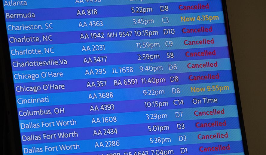 The arrivals board at the American Airlines terminal at LaGuardia Airport displays the flights that have been canceled or delayed and one that is on time, March 21, 2020, in New York. Flight delays and cancellations have bedeviled airline travel so far this year. The Transportation Department is launching a customer service dashboard to assist vacationers ahead of the travel-heavy Labor Day weekend. (AP Photo/Mary Altaffer, File)