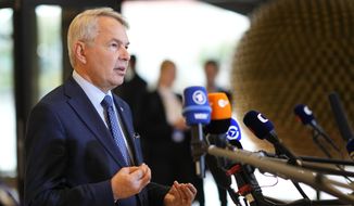 Finland&#39;s Foreign Minister Pekka Haavisto speaks with the media as he arrives for a meeting of EU foreign ministers at the Prague Congress Center in Prague, Czech Republic, on Aug. 31, 2022. Finland on Thursday Sept. 1, 2022 slashed the number of visas issued to Russian citizens to a tenth of the regular amount in a move seen as a show of solidarity with Ukraine. (AP Photo/Petr David Josek, File)