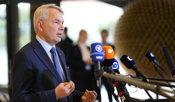 Finland&#39;s Foreign Minister Pekka Haavisto speaks with the media as he arrives for a meeting of EU foreign ministers at the Prague Congress Center in Prague, Czech Republic, on Aug. 31, 2022. Finland on Thursday Sept. 1, 2022 slashed the number of visas issued to Russian citizens to a tenth of the regular amount in a move seen as a show of solidarity with Ukraine. (AP Photo/Petr David Josek, File)