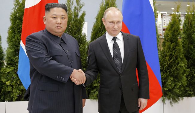 Russian President Vladimir Putin, right, and North Korea&#x27;s leader Kim Jong Un shake hands during their meeting in Vladivostok, Russia, April 25, 2019. As the war in Ukraine stretches into its seventh month, North Korea is hinting at its interest in sending construction workers to help rebuild Russian-occupied territories in the country&#x27;s east. (AP Photo/Alexander Zemlianichenko, Pool, File)