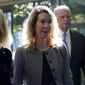 Former Theranos CEO Elizabeth Holmes, middle, and her mother, Noel Holmes, left, arrive at federal court in San Jose, Calif., Thursday, Sept. 1, 2022. (AP Photo/Jeff Chiu)
