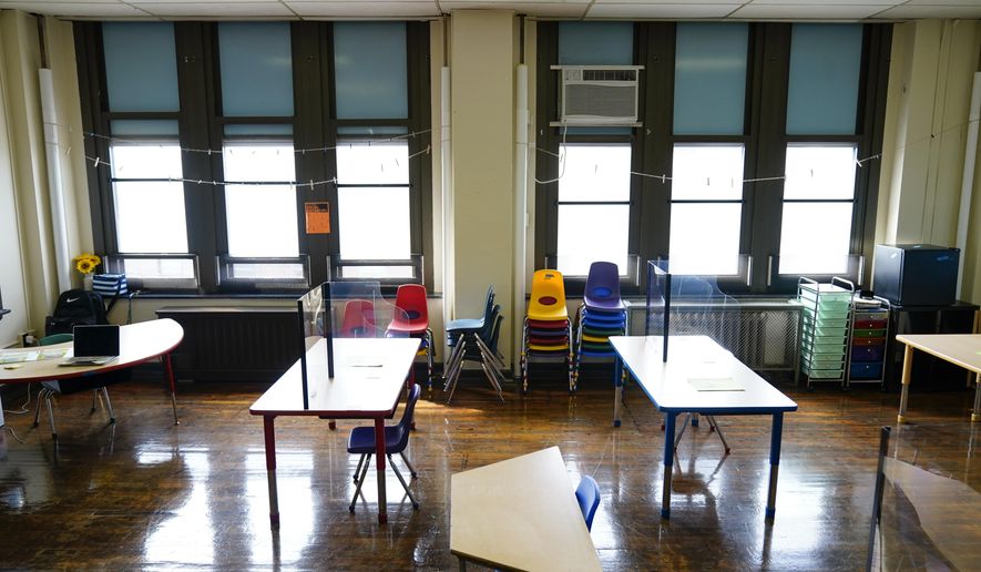 Desks are spaced apart ahead of planned in-person learning at an elementary school on March 19, 2021, in Philadelphia. Pandemic school disruptions resulted in the largest drop in reading achievement in 30 years, according to newly released national test scores on Thursday, Sept. 1, 2022. The data is from 9-year-olds who took the National Assessment of Educational Progress in 2020 and 2022. (AP Photo/Matt Rourke) **FILE**