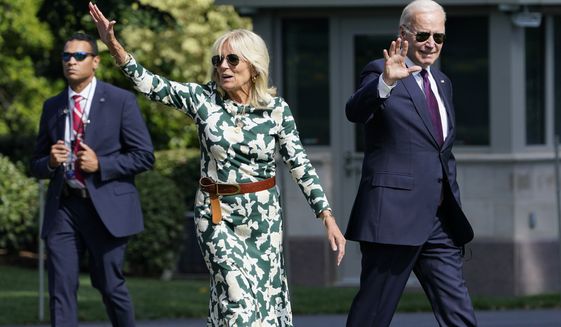 President Joe Biden and first lady Jill Biden wave as they walk towards Marine One on the South Lawn of the White House in Washington, Friday, Sept. 2, 2022, as they head to Camp David for the weekend. (AP Photo/Susan Walsh)
