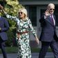 President Joe Biden and first lady Jill Biden wave as they walk towards Marine One on the South Lawn of the White House in Washington, Friday, Sept. 2, 2022, as they head to Camp David for the weekend. (AP Photo/Susan Walsh)