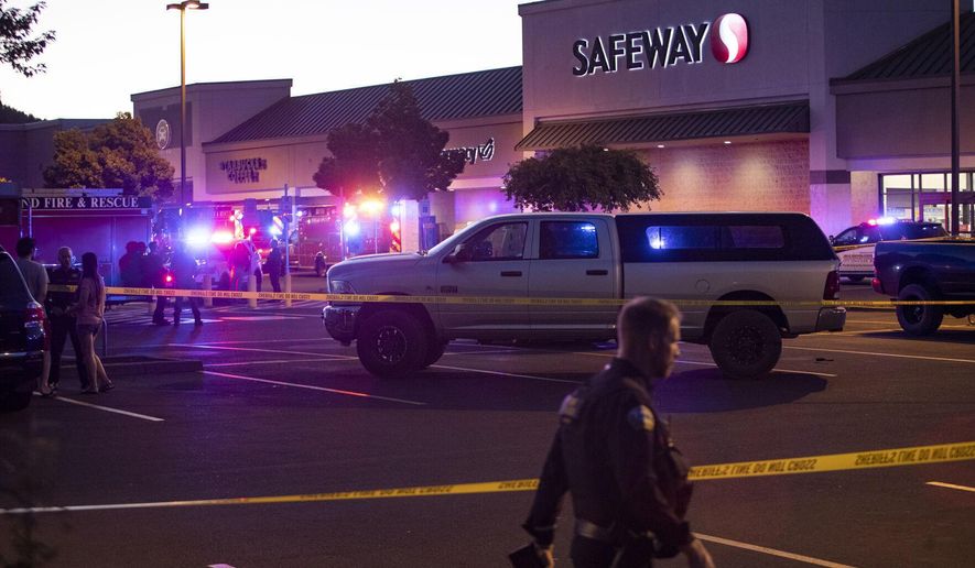 Emergency personnel respond to a shooting at the Forum shopping center in east Bend, Ore., on Aug. 28, 2022. Americans struggled this week to process not one, but multiple high-profile shootings that unfolded in major cities and smaller towns across the U.S. But behind the stand-out headlines about shooting rampages in Bend, Ore., Phoenix, Detroit and Houston were dozens of murders and violent crimes that went largely unnoticed. (Ryan Brennecke/The Bulletin via AP, File)