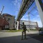 A Russian serviceman guards in an area of the Zaporizhzhia Nuclear Power Station in territory under Russian military control, southeastern Ukraine, Sunday, May 1, 2022. Inspectors from the International Atomic Energy Agency visited the sprawling plant in southern Ukraine on Thursday, Sept. 1, 2022 The IAEA’s Director General Rafael Mariano Grossi highlighted the risks they had to deploy a team in the area amidst the war. (AP Photo, File)