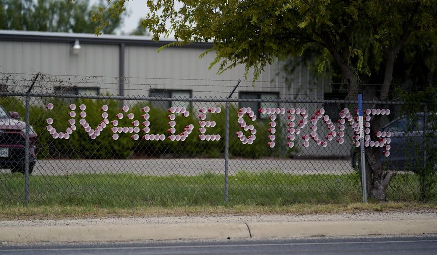 A &#x27;Uvalde Strong&#x27; message is posted in front of the Uvalde County Mental Health building, Tuesday, July 12, 2022, in Uvalde, Texas.  Students who survived the May 24 shooting at an elementary school in Uvalde, Texas are spending the summer grappling with post-traumatic stress disorder. Meanwhile, parents find themselves unable to help them, worried the tragedy at Robb Elementary struck a largely Hispanic town as Latinos continue to face disparities to access mental health care.   (AP Photo/Eric Gay)