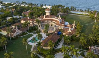 This is an aerial view of President Donald Trump&#39;s Mar-a-Lago estate, Aug. 10, 2022, in Palm Beach, Fla. The National Archives and Records Administration recovered 100 documents bearing classified markings, totaling more than 700 pages, from a initial batch of 15 boxes retrieved from Mar-a-Lago earlier this year. That&#39;s according to newly public correspondence with the Trump legal team. (AP Photo/Steve Helber, File)
