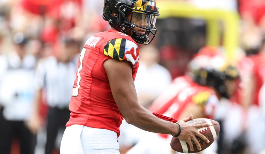 Maryland Terrapins&#39; Starting Quarterback Taulia Tagovailoa (3) gets snapped the ball, looking for an open target at the Maryland Terps Football vs the Buffalo Bulls at Capital One Field  at Maryland Stadium in College Park MD on September 3rd 2022 (Photo: Alyssa Howell)