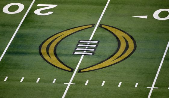 The College Football Playoff logo is shown on the field at AT&amp;amp;T Stadium before the Rose Bowl NCAA college football game between Notre Dame and Alabama in Arlington, Texas, Jan. 1, 2021. The university presidents who oversee the College Football Playoff voted Friday, Sept. 2, 2022, to expand the postseason model for determining a national champion from four to 12 teams no later than the 2026 season. (AP Photo/Roger Steinman, File) **FILE**