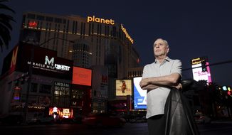 Jeff German, host of &quot;Mobbed Up,&quot; poses with Planet Hollywood, formerly the Aladdin, in the background on the Strip in Las Vegas, Wednesday, June 2, 2021. Authorities say German, a Las Vegas investigative reporter has been stabbed to death outside his home and police are searching for a suspect. The Las Vegas Review-Journal says officers found journalist German dead with stab wounds around 10:30 a.m. Saturday, Sept. 3, 2022, after authorities received a 911 call. (K.M. Cannon/Las Vegas Review-Journal via AP)