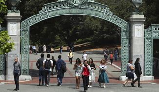 Students walk past Sather Gate on the University of California at Berkeley campus on May 10, 2018, in Berkeley, Calif. President Joe Biden&#39;s student loan forgiveness plan, announced in August 2022, could lift crushing debt burdens from millions of borrowers. However, the tax man may demand a cut of the relief in some states, as some states tax forgiven debt as income. (AP Photo/Ben Margot, File)