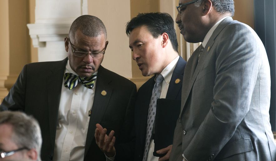 Del. Mark Keam, D-Fairfax, center, talks with Del. Matthew James, D-Portsmouth, right, and Del. Luke Torian, D-Prince William, left, during the House session at the Capitol in Richmond, Va., on Feb. 17, 2016. Keam, the long-serving Democratic member of the House of Delegates from northern Virginia, has resigned his seat, a move that will set up a special election to fill the vacancy in the blue-leaning district. According to a spokesman for GOP House Speaker Todd Gilbert, Keam&#39;s resignation is effective midnight, Tuesday, Sept. 6, 2022. (AP Photo/Steve Helber, File)