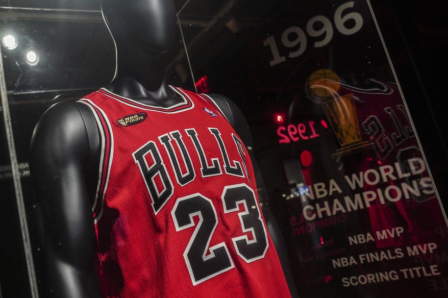 Michael Jordan&#39;s 1998 finals game jersey from his &quot;Last Dance&quot; season is displayed in a glass case, highlighting Sotheby&#39;s sports memorabilia auction dubbed &quot;Invictus,&quot; Tuesday Sept. 6, 2022, in New York. The sale, open through Thursday, Sept. 15, features a variety of athletes who have had deep and lasting impact on their respective sports. (AP Photo/Bebeto Matthews)