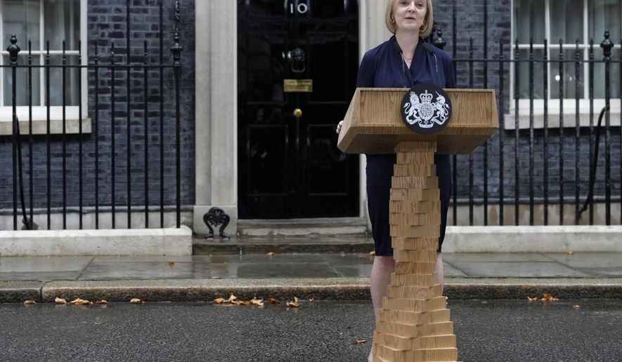 New British Prime Minister Liz Truss makes an address outside Downing Street in London, Tuesday, Sept. 6, 2022 after returning from Balmoral in Scotland where she was formally appointed by Britain&#39;s Queen Elizabeth II. (AP Photo/Kirsty Wigglesworth)