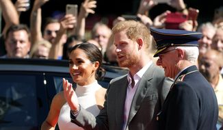 Britain&#39;s Prince Harry, 2nd right, and Meghan, Duchess of Sussex, arrive for a visit at the town hall in Duesseldorf, Germany, Tuesday, Sept. 6, 2022. Prince Harry visits the city as ambassador for the Invictus games, a week-long games for active servicemen and veterans who are ill, injured or wounded, hosted by Duesseldorf next year. (AP Photo/Martin Meissner)