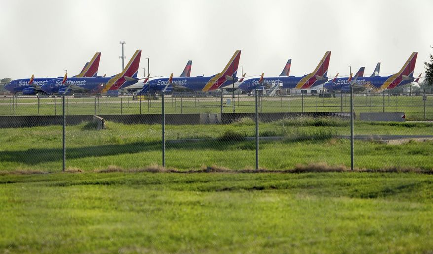 Airplanes are parked on the tarmac during a power outage at Austin-Bergstrom International Airport on Wednesday, Sept. 7, 2022. Airport officials in Austin, Texas, say the early morning power outage is causing flight delays even as electricity has been restored. (Jay Janner/Austin American-Statesman via AP)