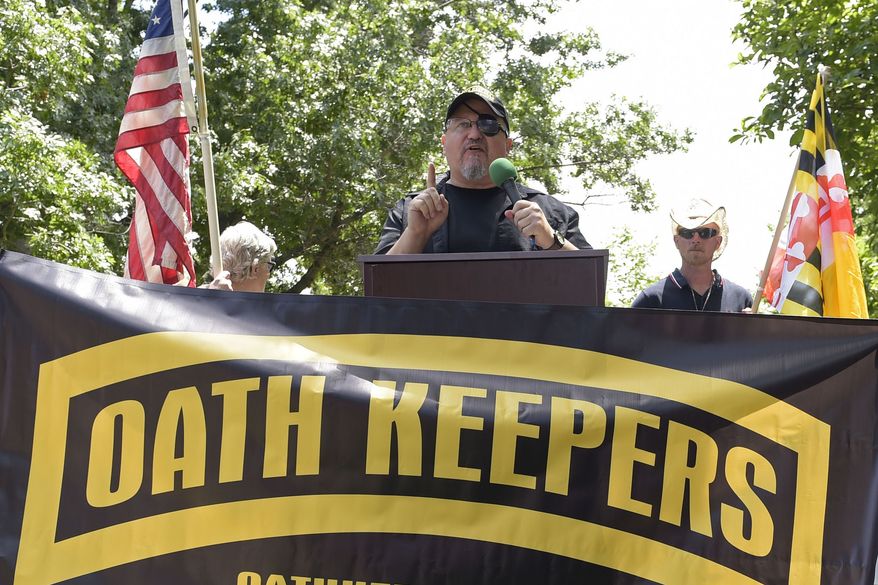 Stewart Rhodes, founder of the Oath Keepers, center, speaks during a rally outside the White House in Washington, June 25, 2017. A new report says that the names of hundreds of U.S. law enforcement officers, elected officials and military members appear on the leaked membership rolls of a far-right extremist group that&#x27;s accused of playing a key role in the Jan. 6, 2021, riot at the U.S. Capitol. The Anti-Defamation League Center on Extremism pored over more than 38,000 names on leaked Oath Keepers membership lists to find more than 370 people it believes are currently working in law enforcement agencies. (AP Photo/Susan Walsh, File)
