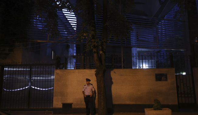 A policeman stands guard outside the Iranian Embassy in Tirana, Albania, Wednesday, Sept. 7, 2022. Albania cut diplomatic ties with Iran and expelled the country&#x27;s embassy staff over a major cyberattack nearly two months ago that was allegedly carried out by Tehran on Albanian government websites, the prime minister said Wednesday. (AP Photo/Franc Zhurda)