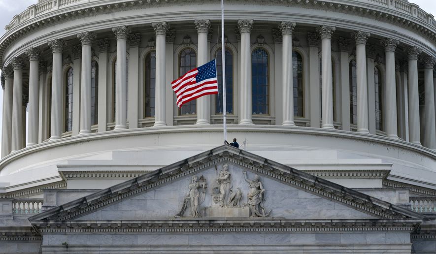 The American flag is lowered to half-staff over the U.S. Capitol, Thursday, Sept. 8, 2022, on Capitol Hill in Washington, after Queen Elizabeth II, Britain&#39;s longest-reigning monarch and a rock of stability across much of a turbulent century, died Thursday after 70 years on the throne. She was 96. (AP Photo/Jacquelyn Martin)