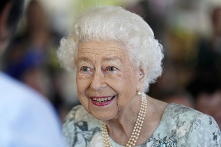 Britain&#39;s Queen Elizabeth II looks on during a visit to officially open the new building at Thames Hospice, Maidenhead, England July 15, 2022. Buckingham Palace says Queen Elizabeth II is under medical supervision as doctors are “concerned for Her Majesty’s health.” The announcement comes a day after the 96-year-old monarch canceled a meeting of her Privy Council and was told to rest. (Kirsty O&#39;Connor/Pool Photo via AP, File)