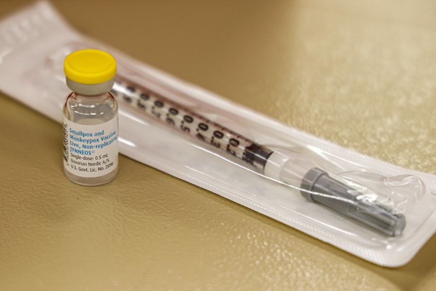 A vial containing the monkeypox vaccine and a syringe is set on the table at a vaccination clinic run by the Mecklenburg County Public Health Department in Charlotte, N.C., Saturday, Aug. 20, 2022. In the wake of a study released on Thursday, Sept. 8, 2022, U.S. officials are considering broadening recommendations for who gets vaccinated against monkeypox, possibly to include many men being treated for HIV or those who recently had other sexually transmitted infections. (AP Photo/Nell Redmond, File)