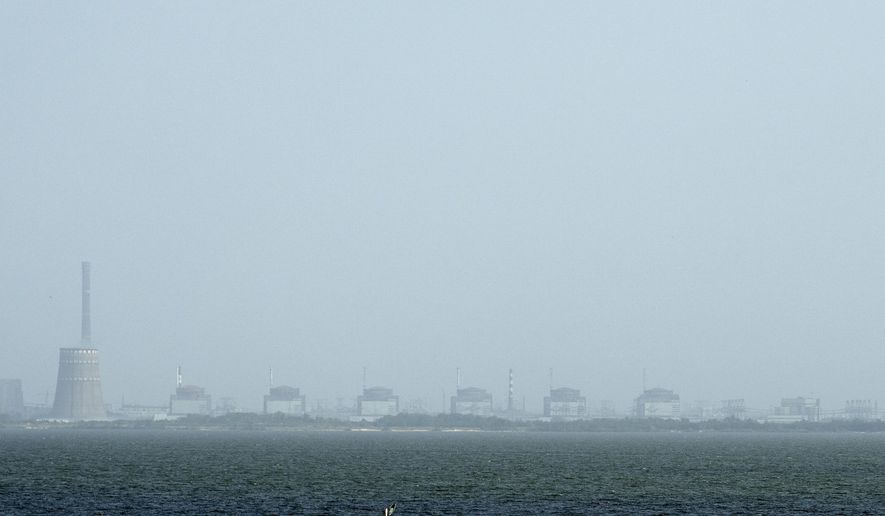 A view of the Zaporizhzhya nuclear plant and the Dnipro river on the other side of Nikopol, Ukraine on Aug, 22, 2022. (AP Photo/Evgeniy Maloletka, File)