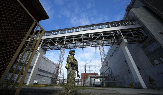A Russian serviceman guards an area of the Zaporizhzhia Nuclear Power Station in territory under Russian military control, southeastern Ukraine, May 1, 2022. Ukraine’s Zaporizhzhia nuclear power plant , built during the Soviet era and one of the 10 biggest in the world, has been engulfed by fighting between Russian and Ukrainian troops in recent weeks, fueling concerns of a nuclear catastrophe. (AP Photo, File)