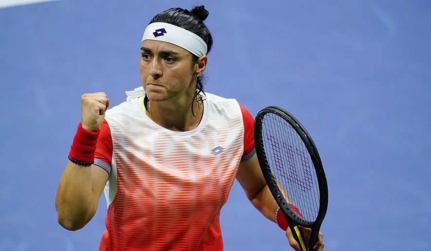 Ons Jabeur, of Tunisia, reacts after scoring a point against Caroline Garcia, of France, during the semifinals of the U.S. Open tennis championships on Thursday, Sept. 8, 2022, in New York. (AP Photo/Matt Rourke)