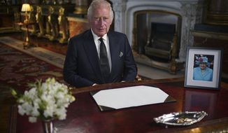 Britain&#39;s King Charles III delivers his address to the nation and the Commonwealth from Buckingham Palace, London, Friday, Sept. 9, 2022, following the death of Queen Elizabeth II on Thursday. (Yui Mok/Pool Photo via AP)