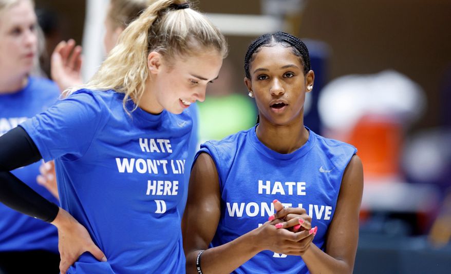 Duke&#39;s Rachel Richardson, right, talks with Gracie Johnson during warmups before the Blue Devils&#39; game against East Tennessee State University in the Duke Invitational at Cameron Indoor Stadium in Durham, N.C., Friday, Sept. 2, 2022. An investigation by Brigham Young University into allegations that fans engaged in racial heckling and uttered racial slurs at Richardson in August 2022 found no evidence to support the claim. BYU issued the results of its investigation into the Aug. 26, 2022, match on Friday, Sept. 9, 2022, reiterating it will not tolerate conduct threatening any student-athlete. (Ethan Hyman/The News &amp; Observer via AP)