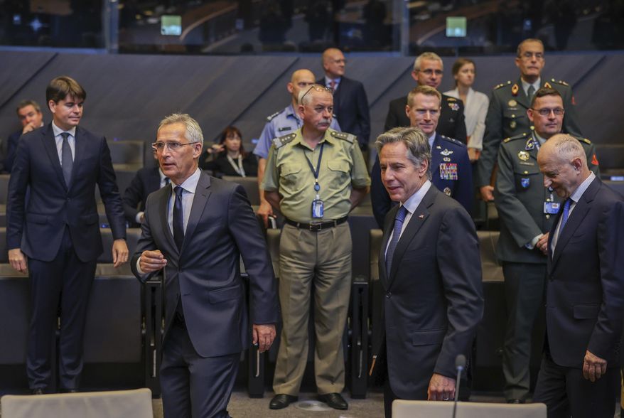 NATO Secretary General Jens Stoltenberg, center left, and US Secretary of State Antony Blinken, center, arrive for a meeting of NATO ambassadors at NATO headquarters in Brussels, Friday, Sept. 9, 2022. (AP Photo/Olivier Matthys, Pool)