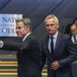 NATO Secretary General Jens Stoltenberg, center, and US Secretary of State Antony Blinken, left, arrive for a meeting of NATO ambassadors at NATO headquarters in Brussels, Friday, Sept. 9, 2022. (AP Photo/Olivier Matthys, Pool)