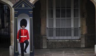 A member of the Coldstream Guards on duty in Friary Court outside of St James&#39;s Palace in London, Saturday, Sept. 10, 2022, before the Accession Council ceremony, where King Charles III is formally proclaimed monarch. Charles automatically became King on the death of his mother, but the Accession Council, attended by Privy Councillors, confirms his role. (Daniel Leal/pool photo via AP)