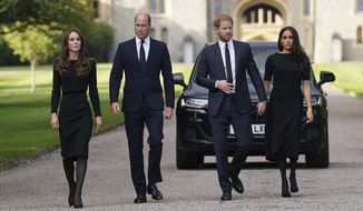 From left, Kate, the Princess of Wales, Prince William, Prince of Wales, Prince Harry and Meghan, Duchess of Sussex walk to meet members of the public at Windsor Castle, following the death of Queen Elizabeth II on Thursday, in Windsor, England, Saturday, Sept. 10, 2022. (Kirsty O&#39;Connor/Pool Photo via AP)