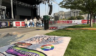 Volunteers help set up for the three-day Boise Pride Festival on Friday, Sept. 9, 2022 in Boise, Idaho. Organizers of the festival have been subjected to intense political pushback from the Idaho GOP and conservative groups in part because of a &amp;quot;Drag Kids&amp;quot; performance scheduled for Sunday. (AP Photo/Rebecca Boone)
