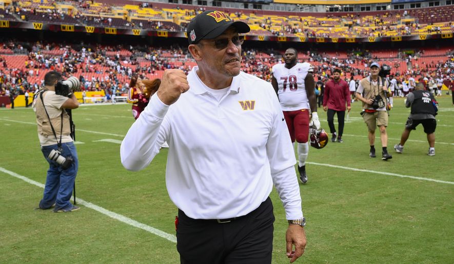 Washington Commanders head coach Ron Rivera pumps his fist as he walks off the field following the end of an NFL football game against the Jacksonville Jaguars, Sunday, Sept. 11, 2022, in Landover, Md. Washington on 28-22. (AP Photo/Nick Wass)