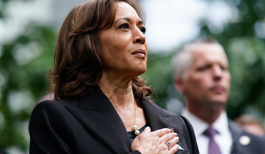 Vice President Kamala Harris stands for the national anthem at the ceremony to commemorate the 21st anniversary of the Sept. 11 terrorist attacks, Sunday, Sept. 11, 2022, at the National September 11 Memorial &amp; Museum in New York. (AP Photo/Julia Nikhinson)