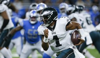 Philadelphia Eagles quarterback Jalen Hurts (1) runs the ball against the Detroit Lions in the first half of an NFL football game in Detroit, Sunday, Sept. 11, 2022. (AP Photo/Duane Burleson)