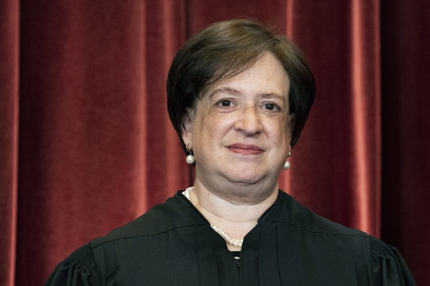 Associate Justice Elena Kagan stands during a group photo at the Supreme Court in Washington, April 23, 2021. Kagan is cautioning that courts look political and forfeit legitimacy when they needlessly overturn precedent and decide more than they have to. Speaking on Sept. 12, 2022, less than three months after a five-justice conservative majority overturned Roe v. Wade&#39;s constitutional guarantee of abortion access, Kagan says the public&#39;s view of the court can be damaged especially when changes in its membership lead to big changes in the law. (Erin Schaff/The New York Times via AP, Pool)