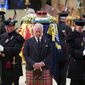 Britain&#39;s King Charles III, center, and other members of the royal family hold a vigil at the coffin of Queen Elizabeth II at St Giles&#39; Cathedral, Edinburgh, Scotland, Monday Sept. 12, 2022. (Jane Barlow/Pool via AP)