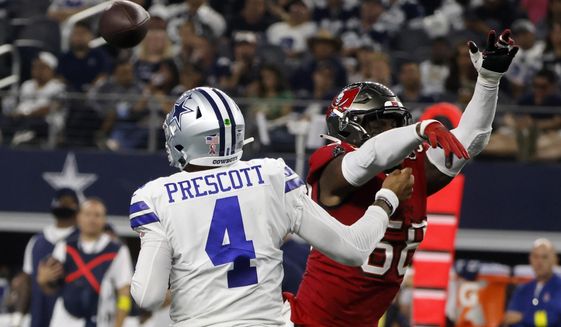 Dallas Cowboys quarterback Dak Prescott (4) is hit by Tampa Bay Buccaneers linebacker Shaquil Barrett (58) while throwing a pass in the second half of a NFL football game in Arlington, Texas, Sunday, Sept. 11, 2022. (AP Photo/Michael Ainsworth) **FILE**