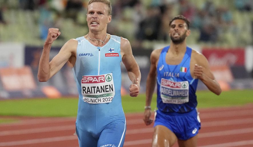 Topi Raitanen, of Finland, celebrates as he crosses the finish line ahead of Ahmed Abdelwahed, of Italy, to win the gold medal in the Men&#39;s 3000 meters steeplechase during the athletics competition in the Olympic Stadium at the European Championships in Munich, Germany, Friday, Aug. 19, 2022. (AP Photo/Matthias Schrader)