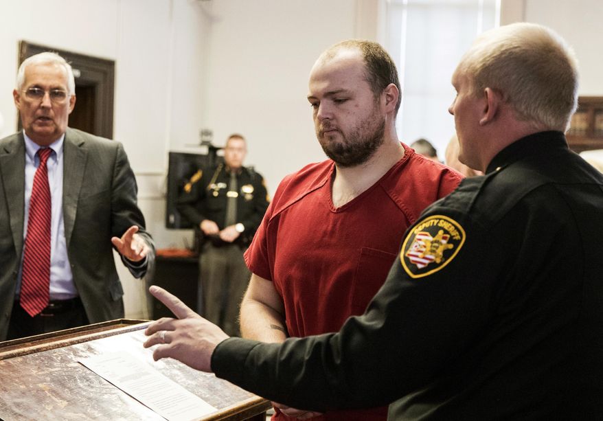 George Wagner IV, center, is escorted out of the courtroom after his arraignment on Nov. 28, 2018, at the Pike County Courthouse, in Waverly, Ohio. Opening statements are expected Monday, Sept. 12, 2022, in the death penalty trial of Wagner, indicted for his role in the death of eight Ohio family members.    (Robert McGraw/The Chillicothe Gazette via AP, Pool, File)