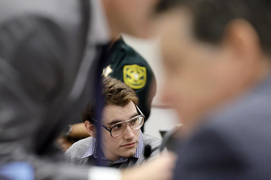 Marjory Stoneman Douglas High School shooter Nikolas Cruz is shown at the defense table during the penalty phase of Cruz&#x27;s trial at the Broward County Courthouse in Fort Lauderdale, Fla., on Monday, Sept. 12, 2022. Cruz pleaded guilty to murdering 17 students and staff members in 2018 at Parkland&#x27;s high school. The trial is only to determine if the 23-year-old is sentenced to death or life without parole. (Amy Beth Bennett/South Florida Sun-Sentinel via AP, Pool)