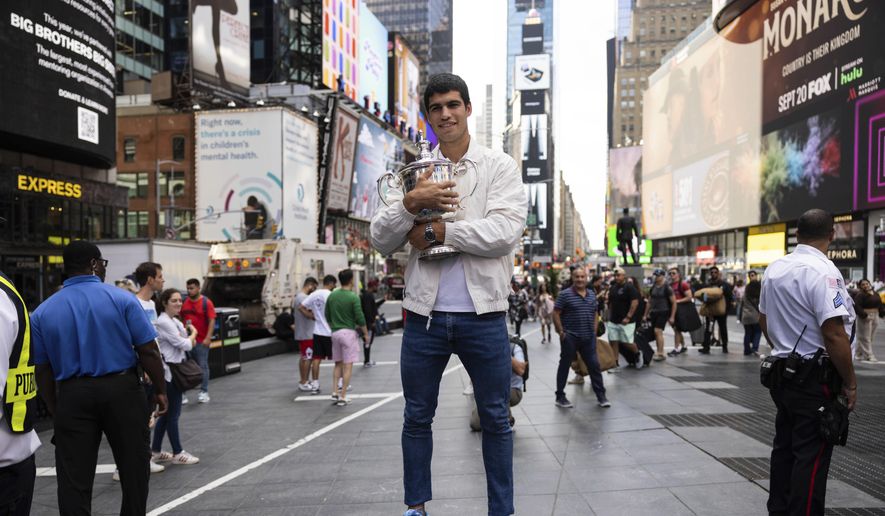 U.S. Open men&#39;s singles tennis champion Carlos Alcaraz poses in Times Square, Monday, Sept. 12, 2022, in New York. (AP Photo/Yuki Iwamura) **FILE**